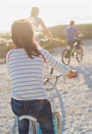 simsearch:6113-08909924,k - Family riding bicycles on sunny beach Stock Photo - Premium Royalty-Free, Code: 6113-07242526