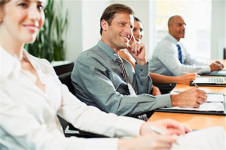 simsearch:6113-07242689,k - Business people sitting in meeting Stock Photo - Premium Royalty-Free, Code: 6113-07242683