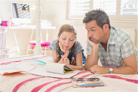 paper pencil top angle - Father helping daughter with homework Photographie de stock - Premium Libres de Droits, Code: 6113-07242788