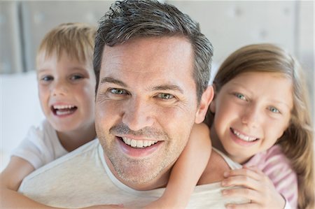 father daughter caucasian not mother not bride not summer - Father and children hugging Stock Photo - Premium Royalty-Free, Code: 6113-07242856