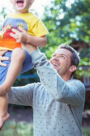 simsearch:6108-06166589,k - Father playing with son outdoors Stock Photo - Premium Royalty-Free, Code: 6113-07242814