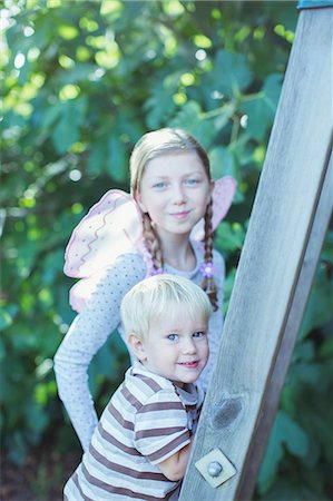 Children climbing ladder outdoors Stock Photo - Premium Royalty-Free, Code: 6113-07242961