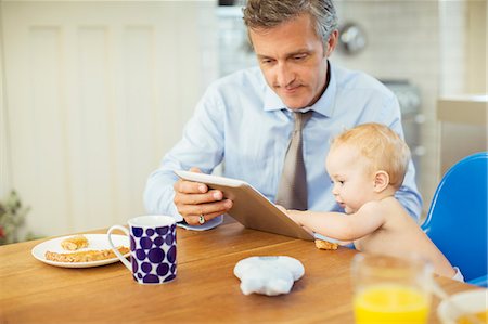 parent communicate with children - Father and baby using digital tablet Stock Photo - Premium Royalty-Free, Code: 6113-07242903