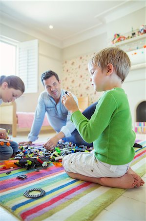 sitting on floor - Father playing with children Stock Photo - Premium Royalty-Free, Code: 6113-07242927