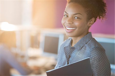 flare copyspace office - Businesswoman smiling in office Stock Photo - Premium Royalty-Free, Code: 6113-07243049