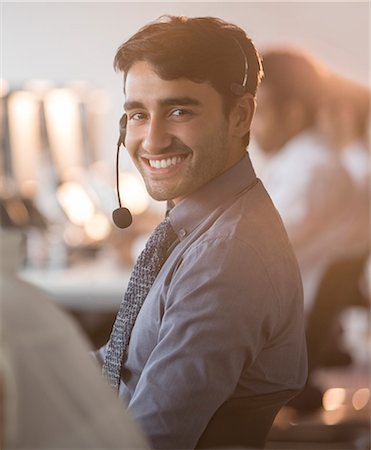 simsearch:400-03945676,k - Businessman wearing headset in office Stock Photo - Premium Royalty-Free, Code: 6113-07243051