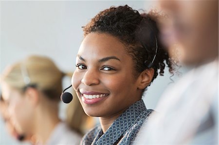 simsearch:6113-07242693,k - Businesswoman wearing headset in office Stock Photo - Premium Royalty-Free, Code: 6113-07243073