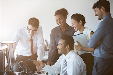 photograph of shirts - Business people working at computer in office Stock Photo - Premium Royalty-Free, Code: 6113-07243077