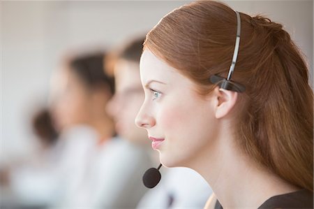 simsearch:6113-07243039,k - Businesswoman wearing headset in office Stock Photo - Premium Royalty-Free, Code: 6113-07243076