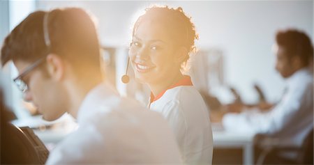 simsearch:6113-07243039,k - Businesswoman wearing headset in office Stock Photo - Premium Royalty-Free, Code: 6113-07243092