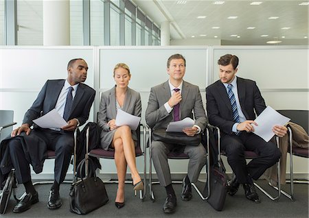 simsearch:6113-07243095,k - Business people sitting in waiting area Stock Photo - Premium Royalty-Free, Code: 6113-07243095