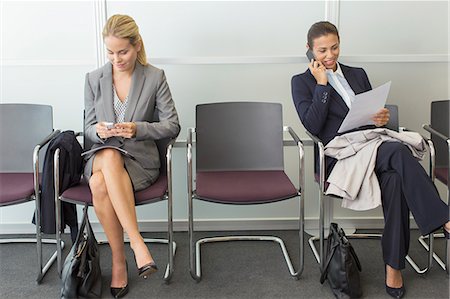 full length two business seated - Businesswomen sitting in waiting area Stock Photo - Premium Royalty-Free, Code: 6113-07243144