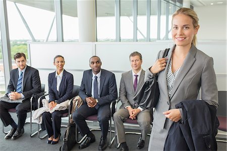 sitting on chair front view - Businesswoman smiling in office Stock Photo - Premium Royalty-Free, Code: 6113-07243183