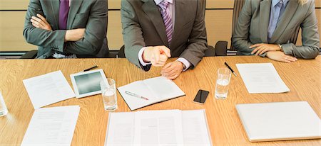 food in rows - Businessman shaking his finger in meeting Stock Photo - Premium Royalty-Free, Code: 6113-07243190