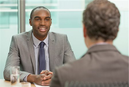 simsearch:6113-07243165,k - Businessmen talking in meeting Stock Photo - Premium Royalty-Free, Code: 6113-07243195