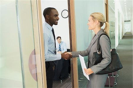 simsearch:6113-06899148,k - Business people shaking hands in office Stock Photo - Premium Royalty-Free, Code: 6113-07243107