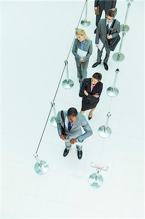 standing in a line - Business people waiting in line Stock Photo - Premium Royalty-Free, Code: 6113-07243129