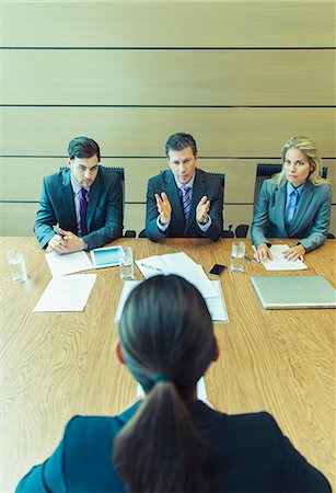 elevated view of a confident businesswoman - Business people talking in meeting Stock Photo - Premium Royalty-Free, Code: 6113-07243247