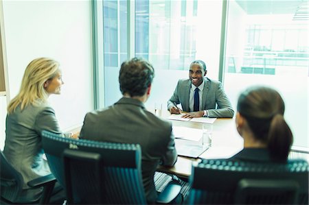 sit on chairs in a row - Business people talking in meeting Stock Photo - Premium Royalty-Free, Code: 6113-07243256