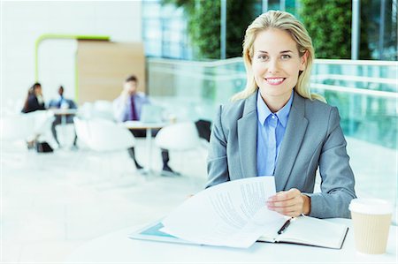 Businesswoman smiling in office Stock Photo - Premium Royalty-Free, Code: 6113-07243260
