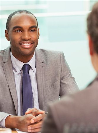 simsearch:6113-07243263,k - Businessmen talking in meeting Stock Photo - Premium Royalty-Free, Code: 6113-07243265