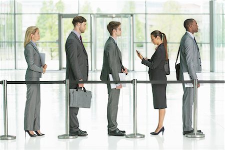 Business people waiting in line Stock Photo - Premium Royalty-Free, Code: 6113-07243202