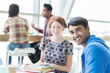 studying - Students smiling in cafe Stock Photo - Premium Royalty-Free, Code: 6113-07243340