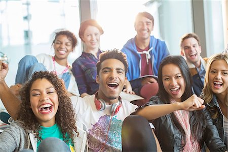 students laughing - Friends cheering together indoors Stock Photo - Premium Royalty-Free, Code: 6113-07243328