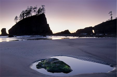 simsearch:6113-07243434,k - Silhouette of cliffs on beach at low tide Stock Photo - Premium Royalty-Free, Code: 6113-07243432