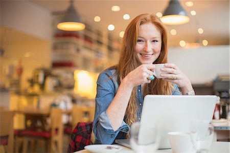 person on computer - Woman using laptop in cafe Stock Photo - Premium Royalty-Free, Code: 6113-07542442