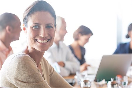 simsearch:6113-07542599,k - Businesswoman smiling in meeting Stock Photo - Premium Royalty-Free, Code: 6113-07542582