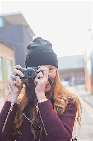 female front shot - Woman using camera on city street Stock Photo - Premium Royalty-Free, Code: 6113-07542500