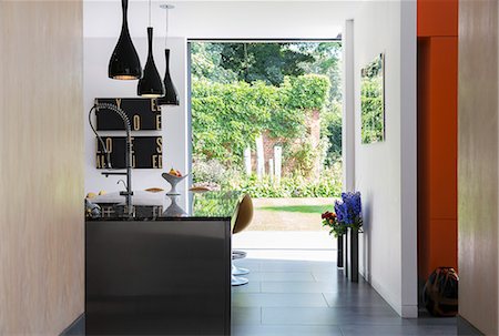 simsearch:6113-07542647,k - View of garden through modern kitchen window Stock Photo - Premium Royalty-Free, Code: 6113-07542656