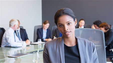 simsearch:6113-06498770,k - Business woman sitting in meeting Foto de stock - Royalty Free Premium, Número: 6113-07542634