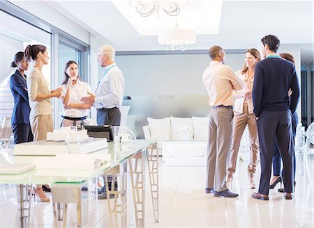 person with scales - Business people talking in office Stock Photo - Premium Royalty-Free, Code: 6113-07542636