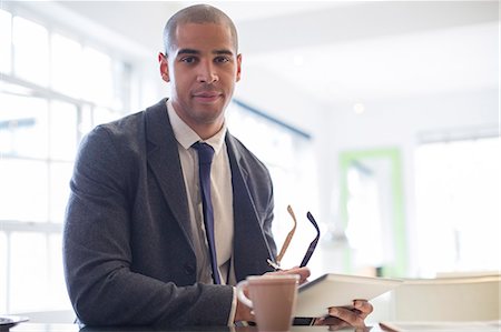 portrait of man holding computer - Businessman using digital tablet Stock Photo - Premium Royalty-Free, Code: 6113-07542893