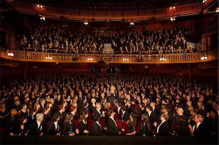 simsearch:6113-07542908,k - Spotlight on audience member clapping in theater Stock Photo - Premium Royalty-Free, Code: 6113-07542944