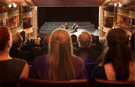 stage - Audience watching quarter perform on stage in theater Stock Photo - Premium Royalty-Free, Code: 6113-07542951