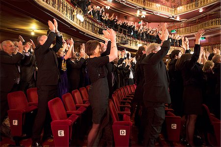 people clapping hands - Audience applauding in theater Stock Photo - Premium Royalty-Free, Code: 6113-07542959