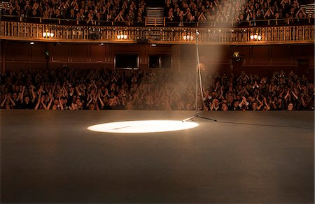 entertainment theatre - Spotlight shining on stage in theater Stock Photo - Premium Royalty-Free, Code: 6113-07542911