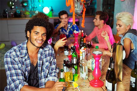 drinking shots - Man smiling at party Stock Photo - Premium Royalty-Free, Code: 6113-07543021