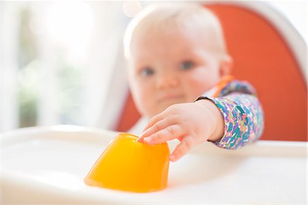 simsearch:6113-07731339,k - Baby girl eating in high chair Stock Photo - Premium Royalty-Free, Code: 6113-07543149