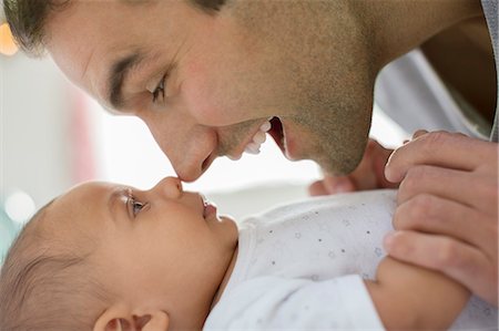 simsearch:6113-07543282,k - Father rubbing noses with baby boy Stock Photo - Premium Royalty-Free, Code: 6113-07543177