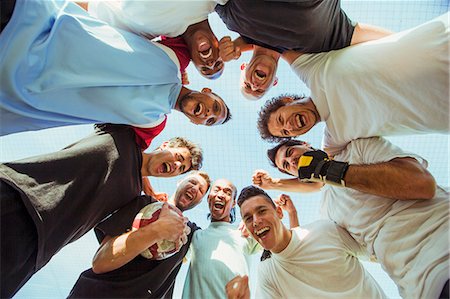 simsearch:6113-09005163,k - Men cheering together outdoors Stock Photo - Premium Royalty-Free, Code: 6113-07543104