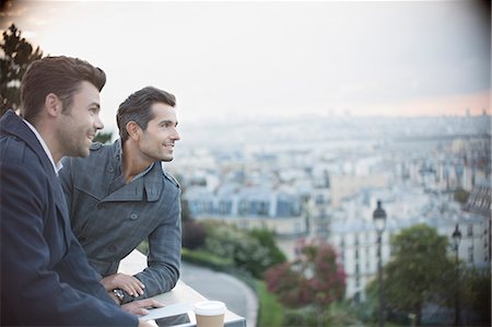 friendship business - Businessmen overlooking cityscape, Paris, France Stock Photo - Premium Royalty-Free, Code: 6113-07543456