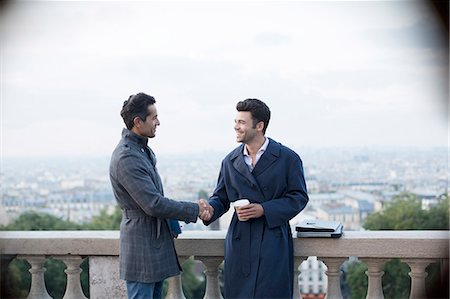 simsearch:6113-07543445,k - Businessmen shaking hands at railing overlooking Paris, France Stock Photo - Premium Royalty-Free, Code: 6113-07543479