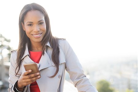 platz für text - Businesswoman using cell phone outdoors Stockbilder - Premium RF Lizenzfrei, Bildnummer: 6113-07543486