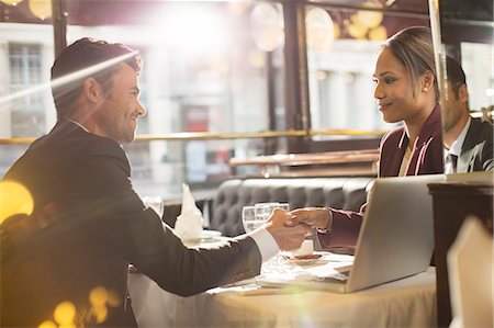 simsearch:6113-06899028,k - Business people shaking hands in restaurant Stock Photo - Premium Royalty-Free, Code: 6113-07543428