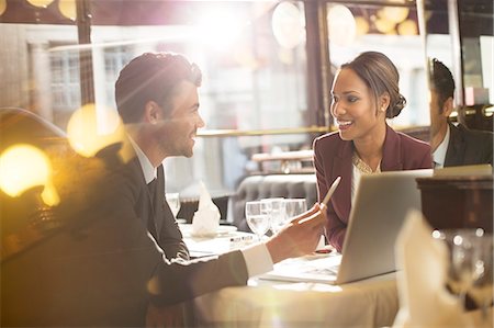 people holding - Business people talking in restaurant Stock Photo - Premium Royalty-Free, Code: 6113-07543434