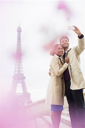 france couple - Couple taking self-portrait in front of Eiffel Tower, Paris, France Stock Photo - Premium Royalty-Free, Code: 6113-07543590